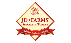 A colorful logo for JD Farms Specialty Turkey, located in Maple Ridge BC, featuring a turkey image and the tagline "Traditional goodness...every day".
