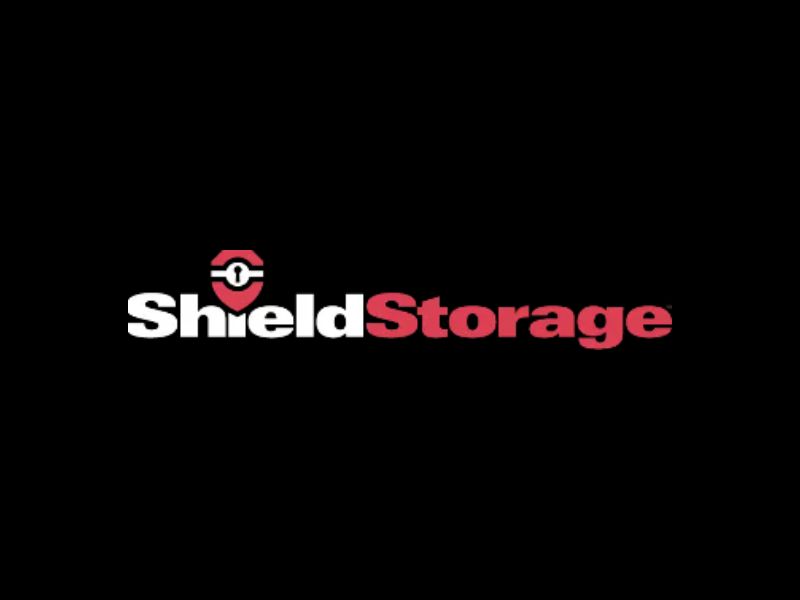 The Shield Storage logo, possibly a business in Maple Ridge BC, is displayed in white and red on a black background.